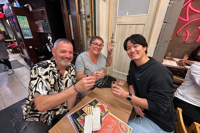 Conveyor Belt Sushi & Bar Hopping in Ebisu & Nakameguro - Choosing sushi from a moving belt in Nakameguro