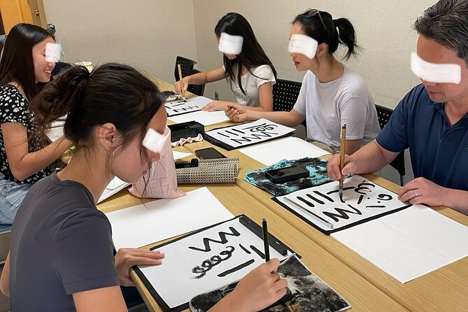 Japanese culture and calligraphy in Tokyo! - Choosing the tattoo sticker or T-shirt option