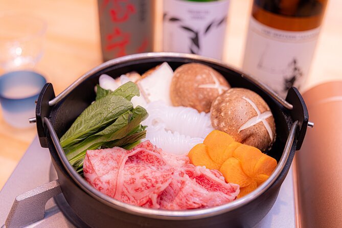 Japanese Sake Tasting & Wagyu Sukiyaki Cooking Class in Tokyo - Eating your own sukiyaki with sake