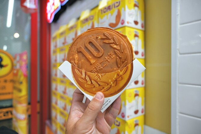 Shibuya by night in Small Groups: Neon Lights and Local Flavors - An onigiri stop at Antenna 21