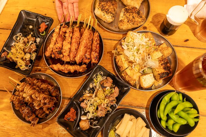 Shinjuku Underground Nightlife Tour: Izakaya Food & Bar Hopping - Omoide Yokocho begins with food and atmosphere
