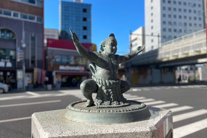 Tokyo: Enjoy Sumo match and know about it! [Ticket included] - Sumo shops, capsule toys, snacks, and arena atmosphere