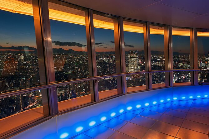 Tokyo Night E-Bike Tour with Tokyo Tower and Dolphin Show - Riding through Minato after dark