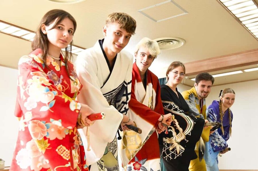 Tokyo: Taishu Engeki Show with Kimono and Sword Lesson - Learning fan dance in a kimono