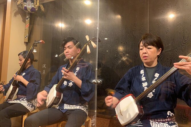 Tsugaru shamisen performance over traditional dinner - Dinner in a small Japanese restaurant